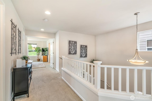 corridor featuring carpet flooring, recessed lighting, and baseboards