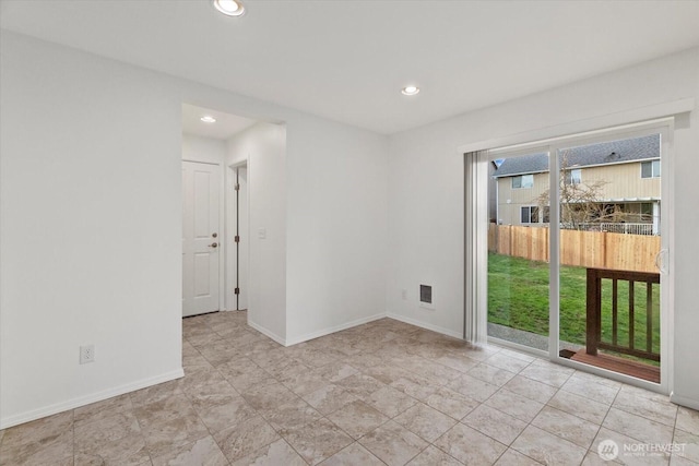 spare room with visible vents, recessed lighting, and baseboards