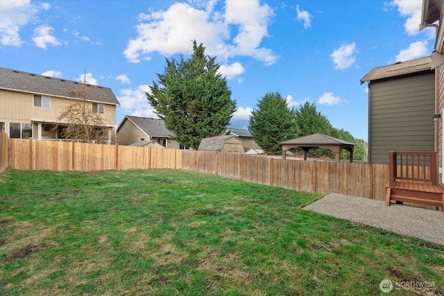 view of yard featuring a gazebo and fence