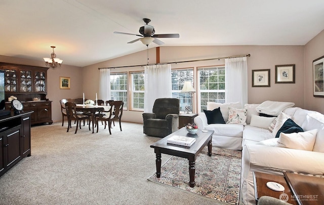 living room with lofted ceiling, light carpet, and ceiling fan with notable chandelier