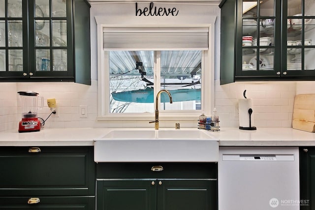 bar featuring tasteful backsplash, a sink, and white dishwasher