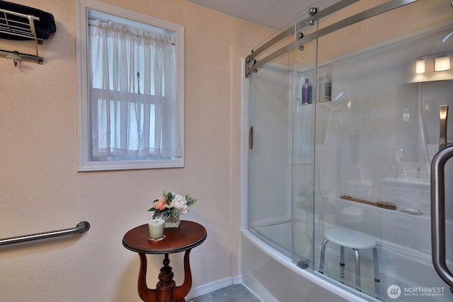 bathroom with enclosed tub / shower combo