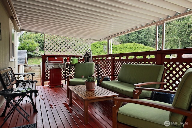 deck featuring an outdoor living space and area for grilling