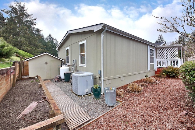 view of side of home with fence