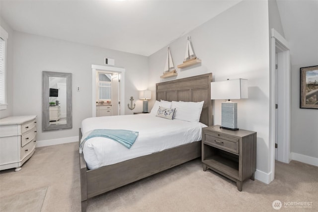 bedroom featuring light carpet and baseboards