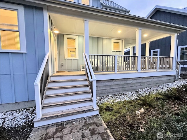 property entrance featuring a porch and board and batten siding