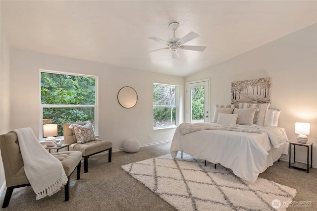 carpeted bedroom featuring baseboards, access to outside, a ceiling fan, and vaulted ceiling