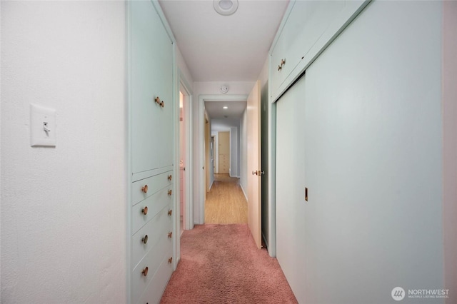 hallway with light carpet