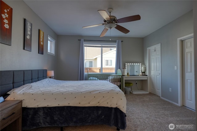 carpeted bedroom featuring a ceiling fan and baseboards