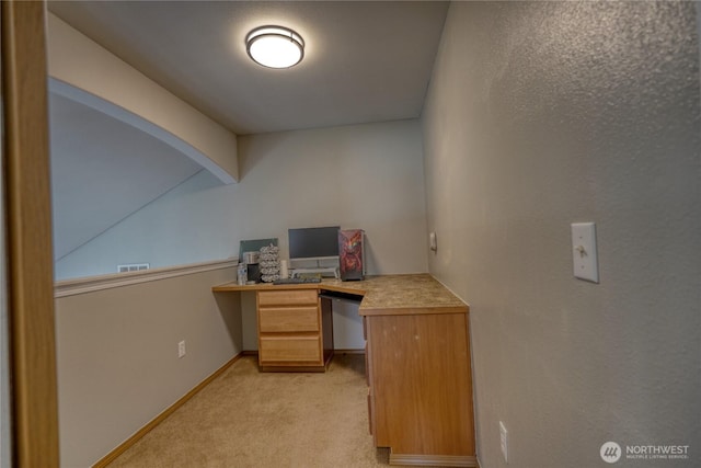 office with light carpet, vaulted ceiling with beams, built in study area, and baseboards