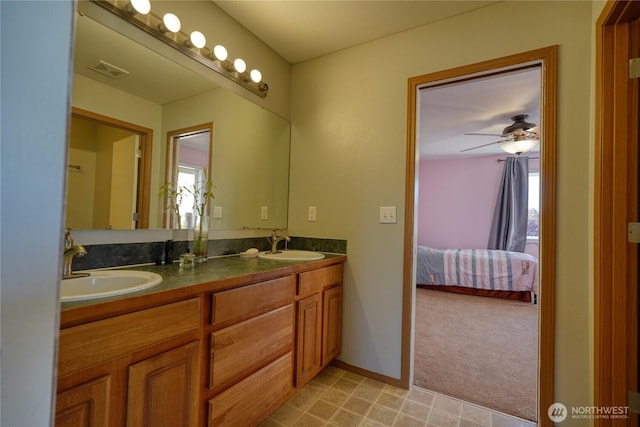 full bath with double vanity, visible vents, ensuite bathroom, and a sink