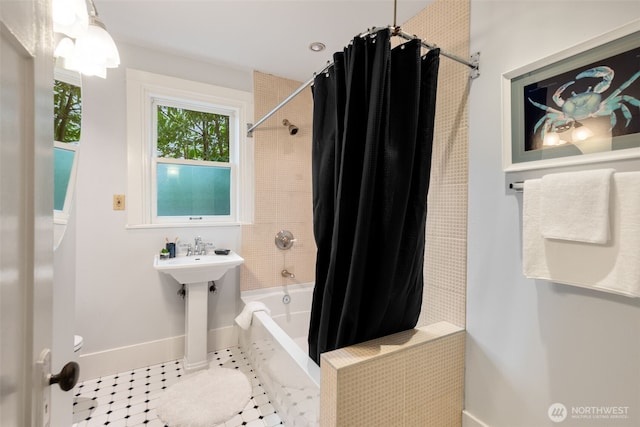 full bathroom with tile patterned floors, baseboards, toilet, and shower / bath combination with curtain