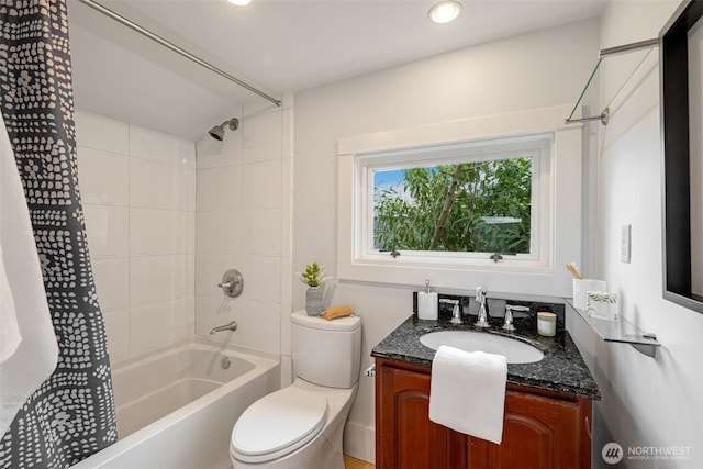 full bathroom with shower / bathtub combination with curtain, toilet, and vanity