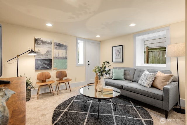 living room with recessed lighting, baseboards, and carpet