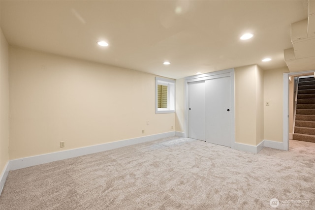 unfurnished bedroom featuring recessed lighting, a closet, carpet floors, and baseboards