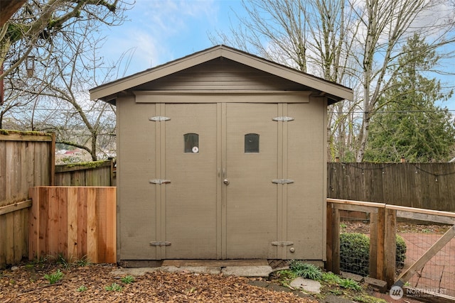 view of shed with a fenced backyard