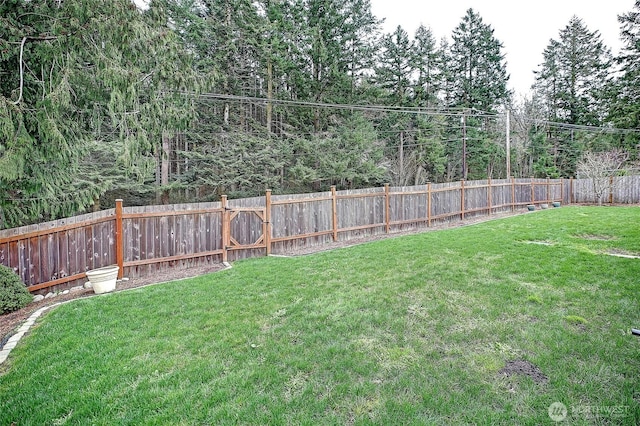 view of yard featuring a fenced backyard