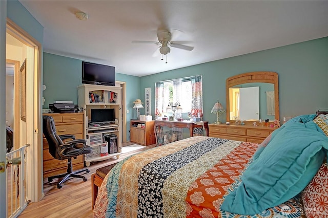 bedroom with light wood-style flooring and ceiling fan