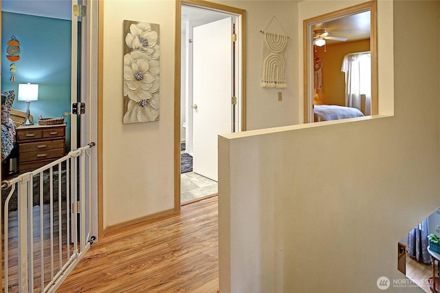 corridor with light wood-style flooring