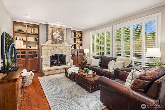 living room with a stone fireplace, crown molding, and dark wood-style floors