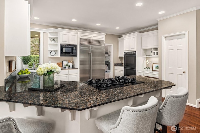 kitchen with black appliances, white cabinets, a peninsula, and open shelves