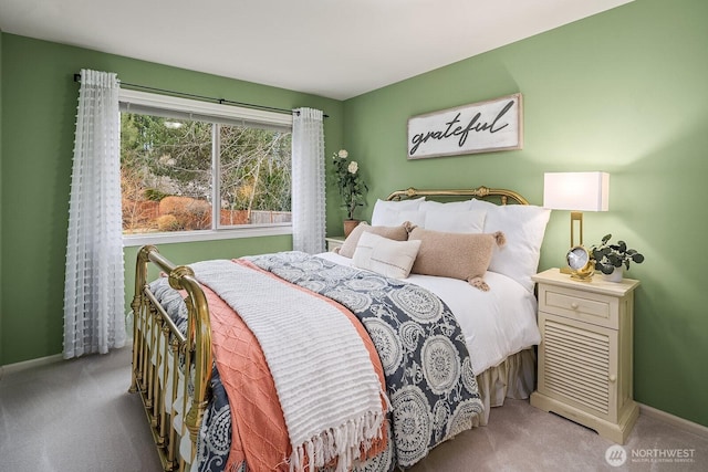 bedroom featuring baseboards and carpet floors