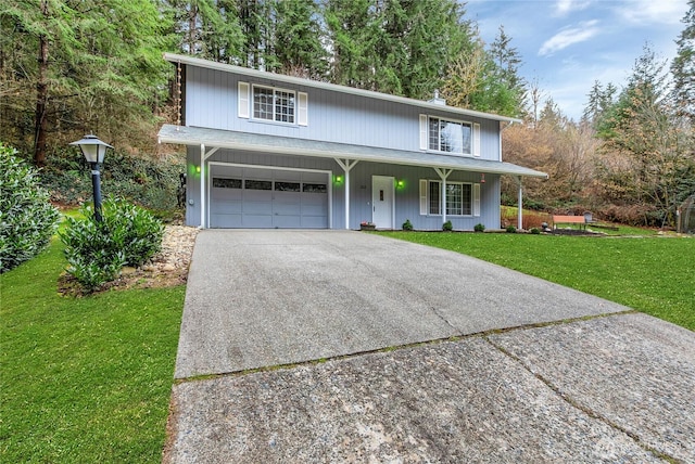 traditional home with a porch, driveway, an attached garage, and a front lawn