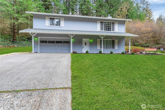 traditional home with a porch, a front yard, an attached garage, and driveway