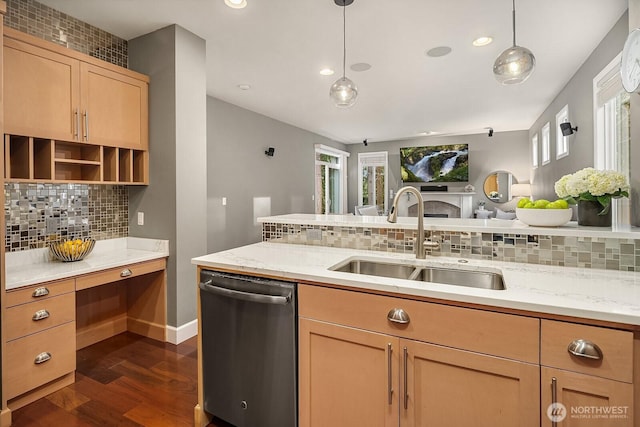 kitchen with dark wood-style floors, a sink, stainless steel dishwasher, decorative light fixtures, and tasteful backsplash