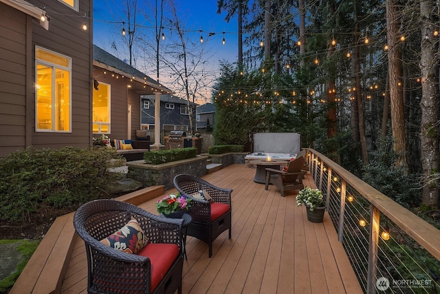 wooden terrace with a fire pit