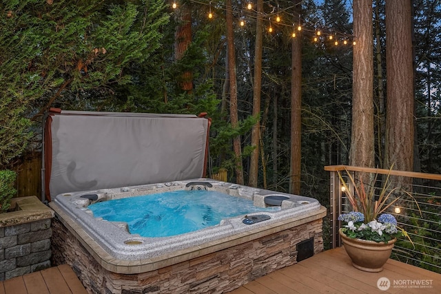 wooden terrace with a covered hot tub