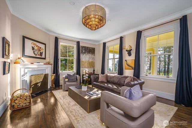 living room with a fireplace with flush hearth, baseboards, wood-type flooring, and ornamental molding