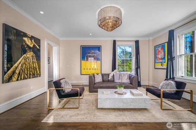 living room featuring baseboards, wood finished floors, and ornamental molding