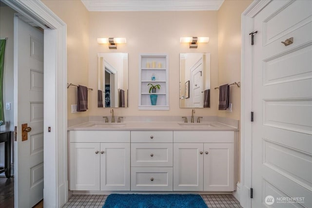 full bath with crown molding, double vanity, and a sink