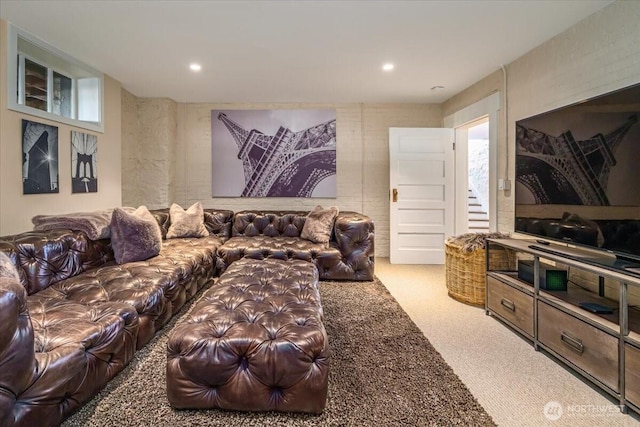 carpeted living area with recessed lighting