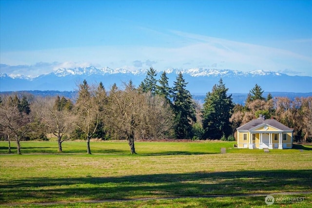 property view of mountains featuring a wooded view