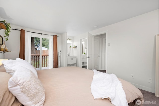 carpeted bedroom featuring access to exterior, connected bathroom, and baseboards