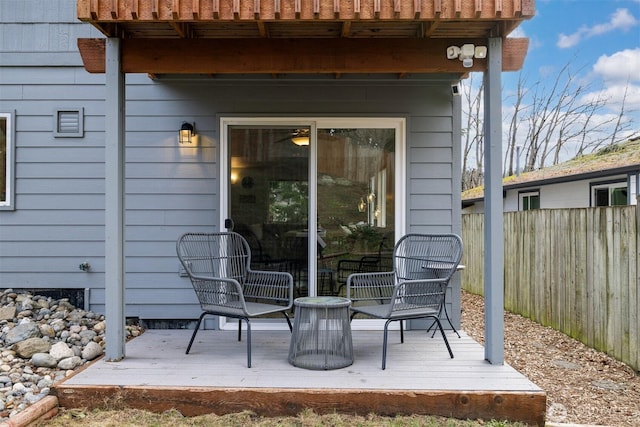 exterior space featuring a wooden deck and fence