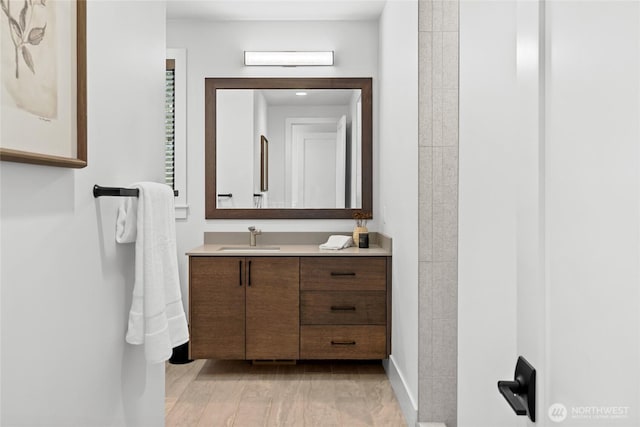 bathroom featuring vanity and baseboards