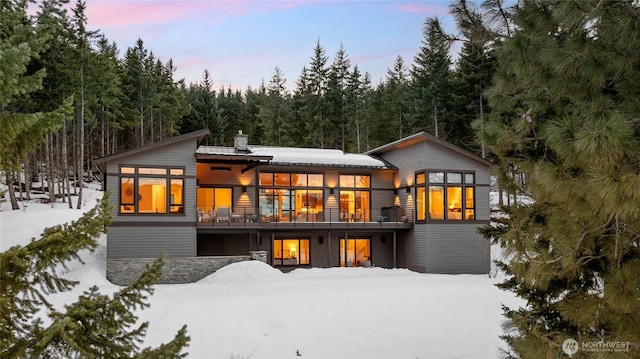 view of snow covered house