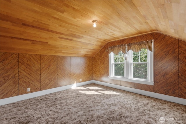 bonus room with lofted ceiling, wood walls, and wood ceiling