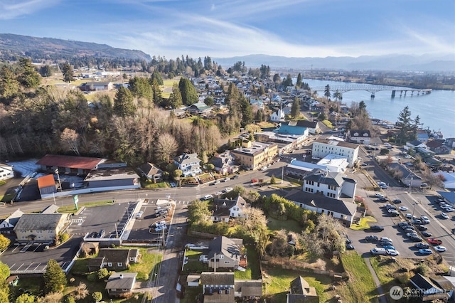 aerial view featuring a water and mountain view