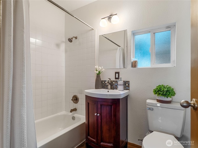 full bathroom featuring shower / bath combination with curtain, toilet, and vanity