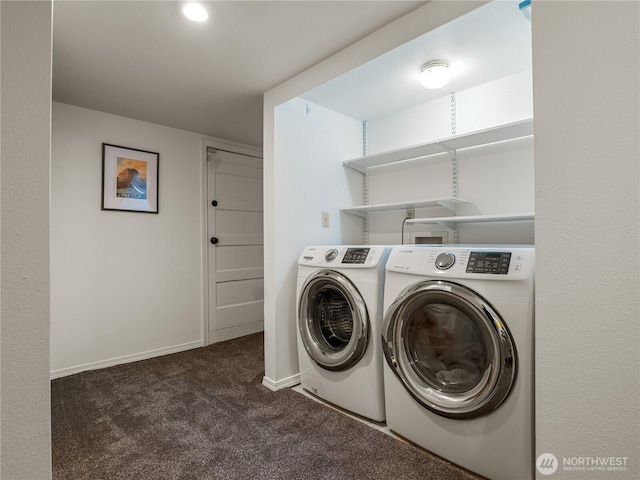 clothes washing area featuring baseboards, separate washer and dryer, laundry area, and carpet