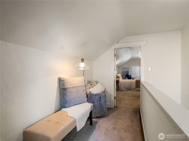 living area featuring carpet flooring and vaulted ceiling