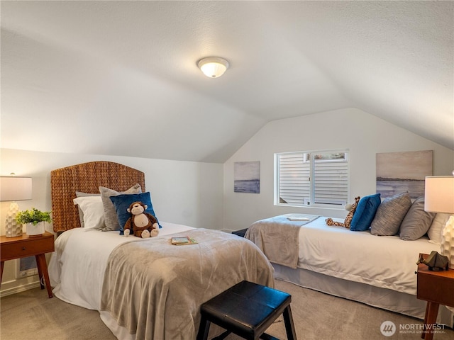 bedroom with vaulted ceiling and carpet