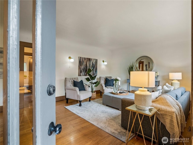 living room featuring baseboards and wood finished floors