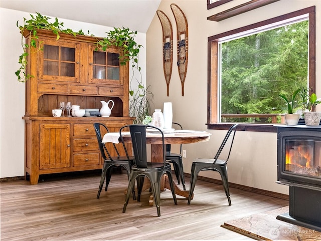 dining room with baseboards and light wood-style floors