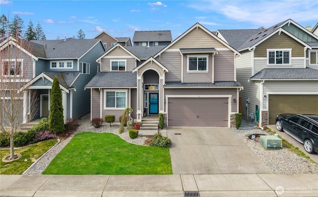 view of front of home featuring a front lawn, an attached garage, driveway, and a shingled roof