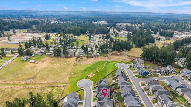 bird's eye view with a residential view and a wooded view